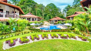 A resort with multiple buildings, a central pool, and lush landscaping. - Terrazas del Caribe Hotel (Cahuita)