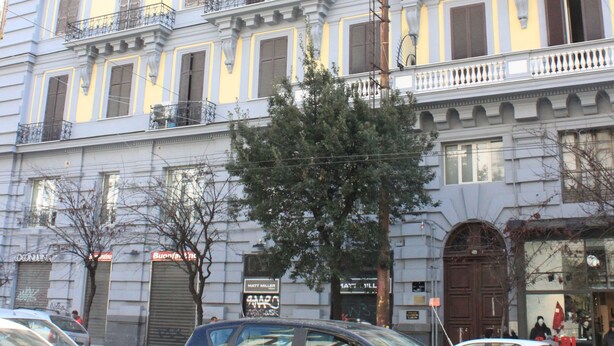 A multi-story building with balconies and large windows. - Alambrado Rooms & Suites (Naples)