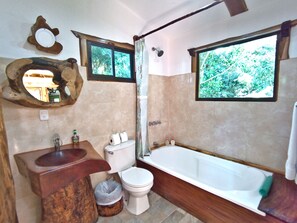 Combined shower/tub, hair dryer, towels, soap