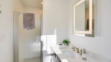 Shower, hair dryer, towels, toilet paper