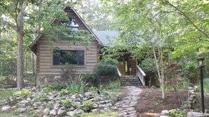A rustic cabin with a stone pathway leading to a wooden staircase. - Very private luxury log home - Now with free 5G Wi-Fi! (Millboro)