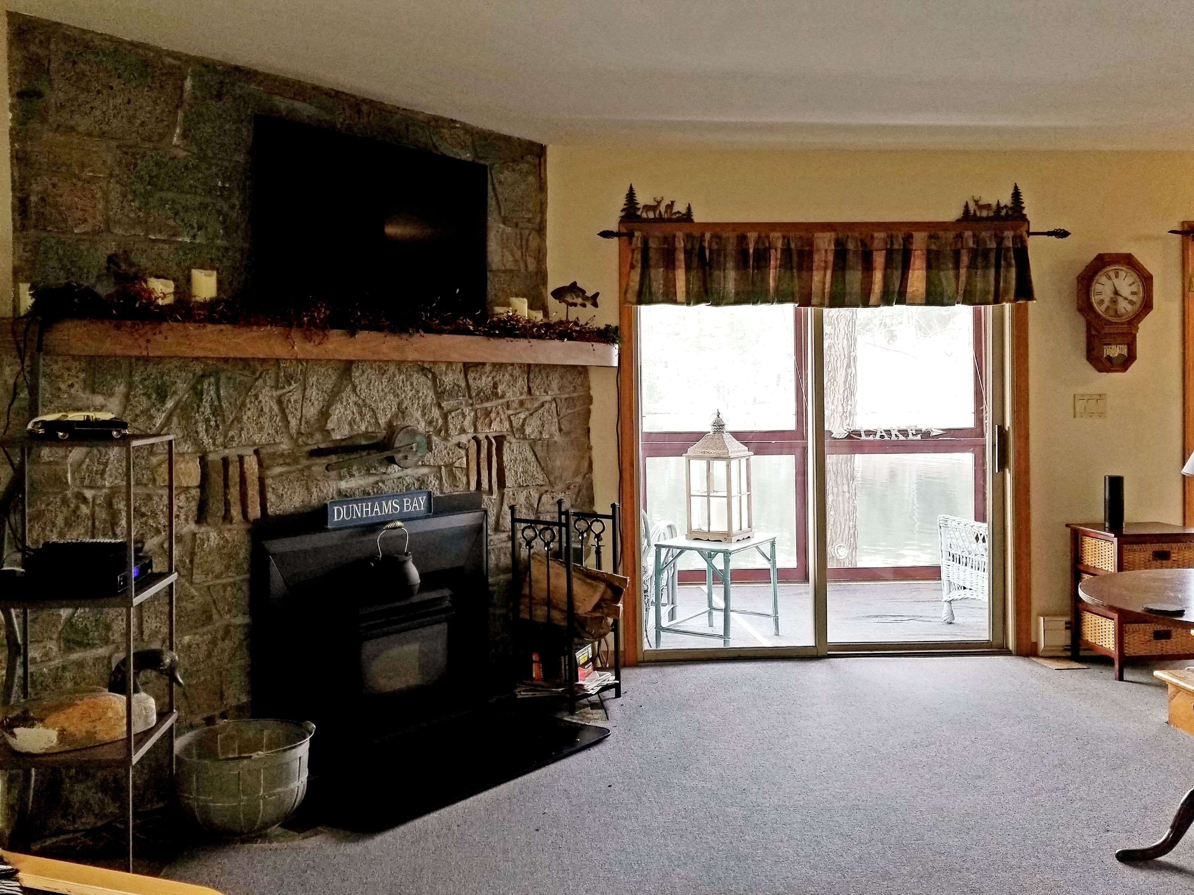 Enjoy the fall colors on this lakeside porch in Dunhams Bay.  