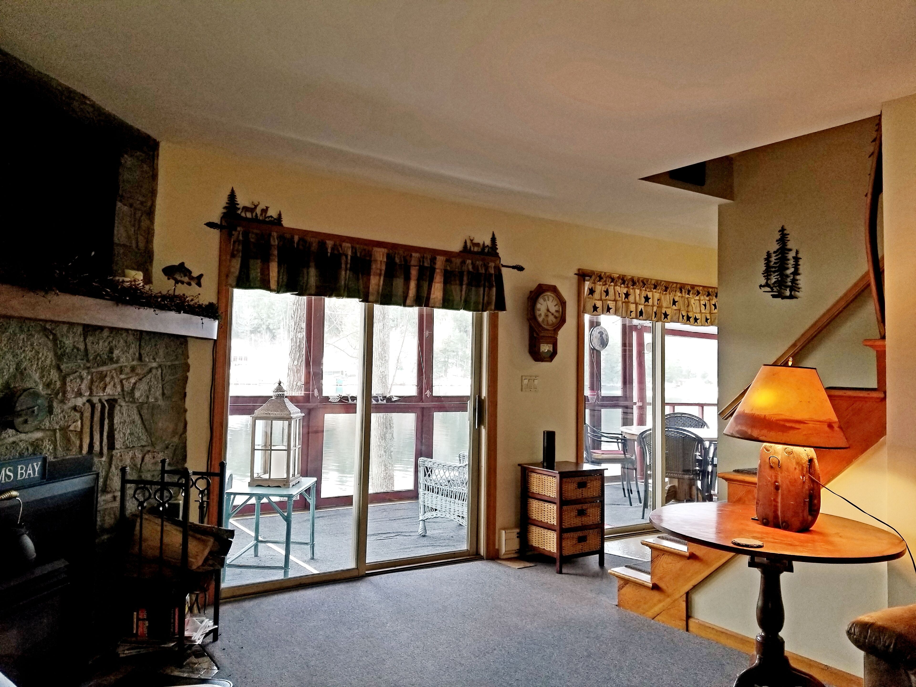 Enjoy the fall colors on this lakeside porch in Dunhams Bay.  