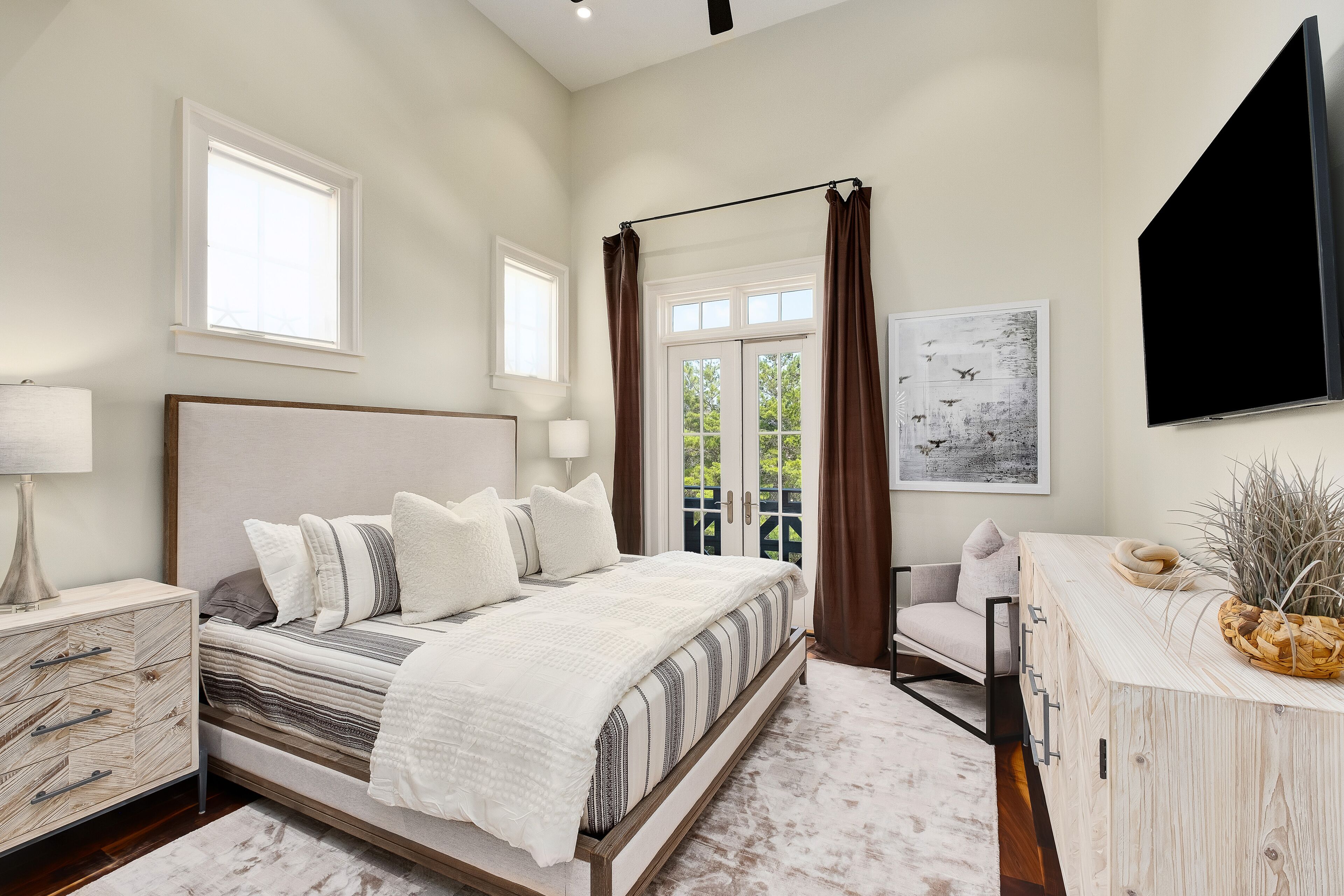 King Bedroom 3 with balcony seating for two overlooking pool,65 inch samaung tv