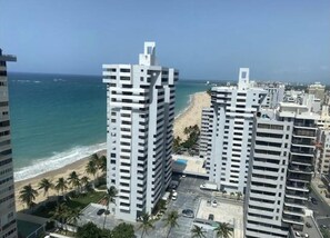 Enjoy ocean views from the comfort of your room, with access to the beach and palm trees.