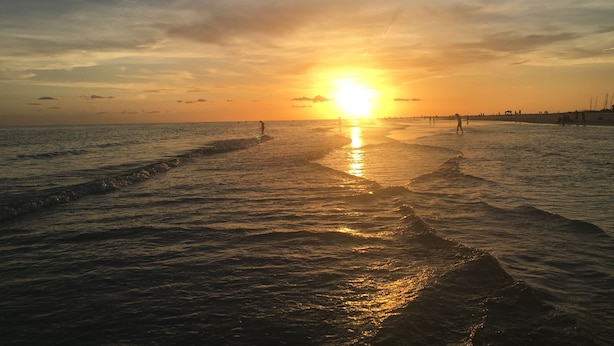 A beach with a sunset over the ocean, waves gently lapping at the shore. - A GEM-Beach Cottage 4 BR,Heated Pool on Canal, 1 Block To Village, Walk to Beach (Sarasota)