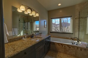 Bathtub, hair dryer, towels, soap