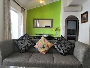 Grand Apartment, 2 Bedrooms, Courtyard View, Courtyard Area | Living area | Flat-screen TV - Kaa Xel (Playa del Carmen)
