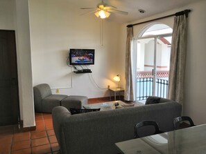 Grand Apartment, 2 Bedrooms, Courtyard View, Courtyard Area | Living area | Flat-screen TV - Kaa Xel (Playa del Carmen)