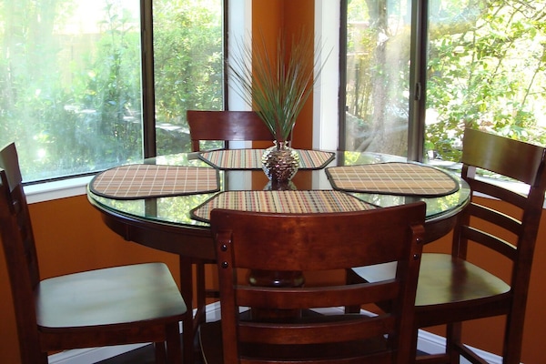 Breakfast nook adjacent to kitchen. Extra chairs and high chair in garage.