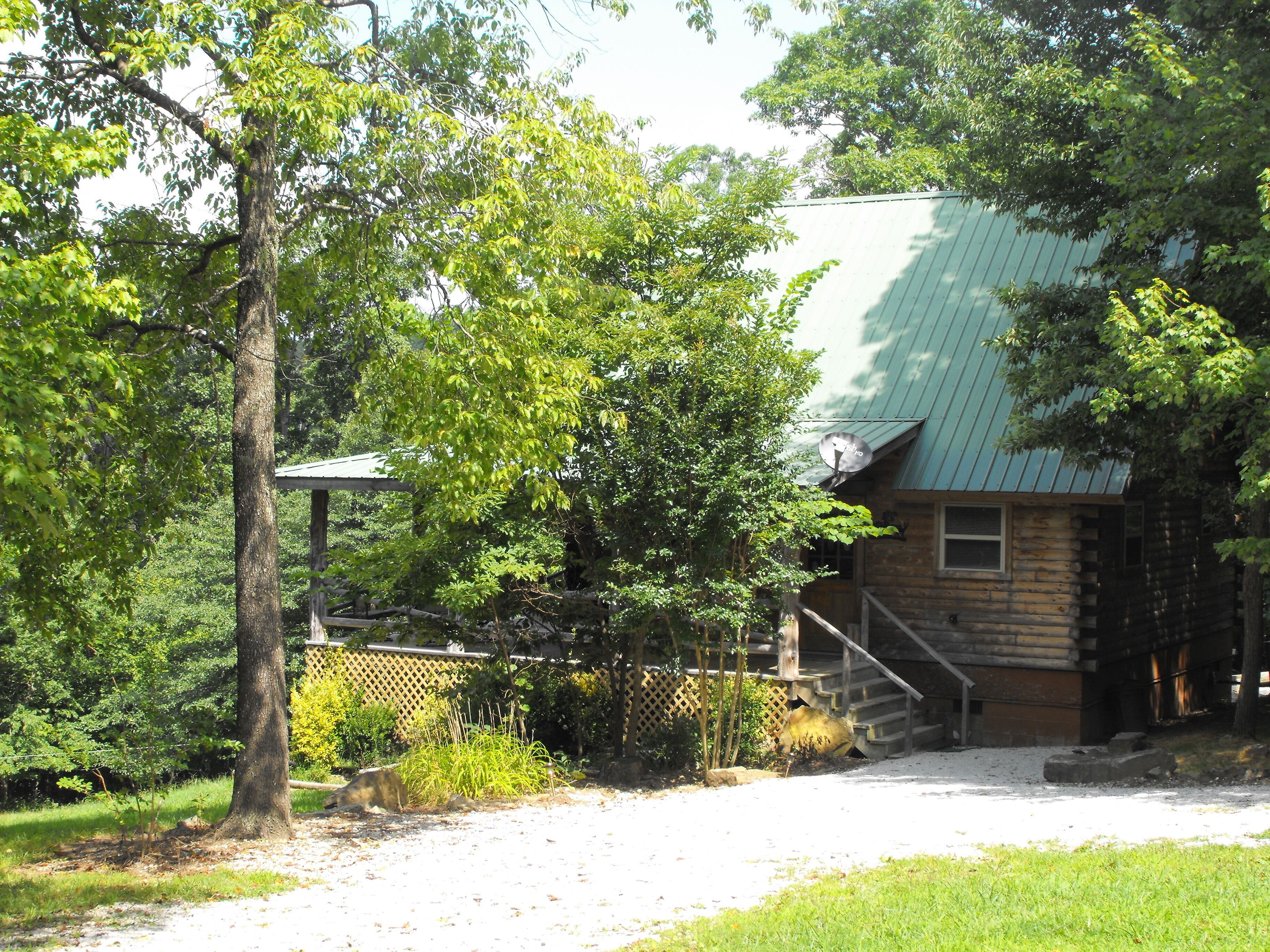 Deer Cabin Of Deer Lodge Cabin Rentals is a Secluded Ozark Cedar Log Cabin