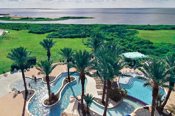 Heated Lazy river pool: bay side. Golf cart tunnel under the highway for access.