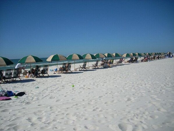 On the beach, sun-loungers