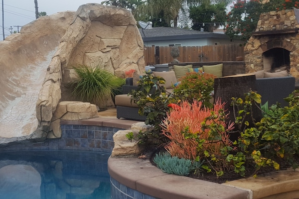 Enjoy the pool, slide, spa, bbq's, fireplace/firepit all in your own backyard!