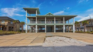 A large, two-story beachfront house with a covered porch and multiple balconies. - 🌊 The Great Escape | Sleeps 22 w/ Gulf Views, Private Pool, + Crow's Nest 🏖️ (Pensacola Beach)