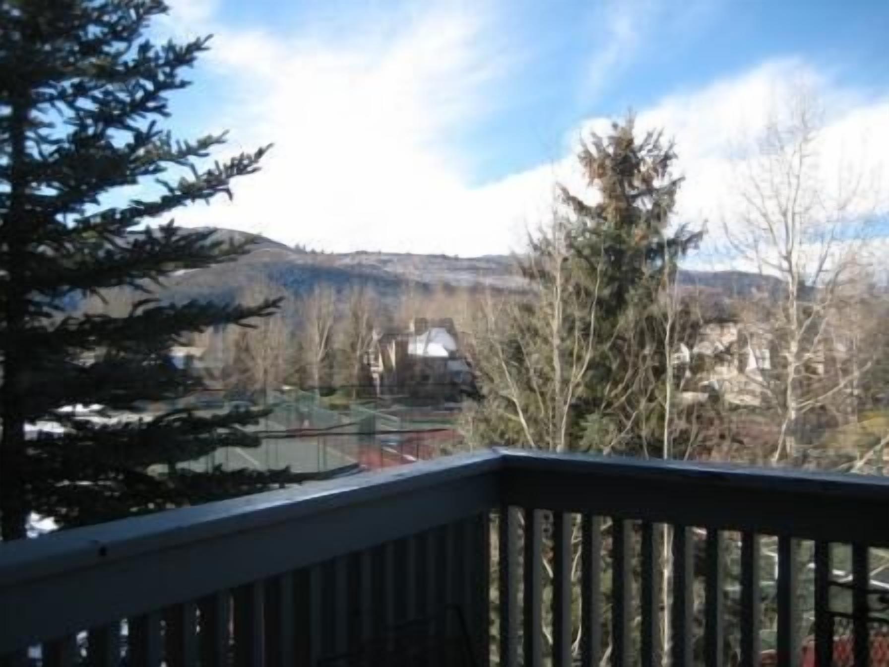 View of tennis courts from deck.