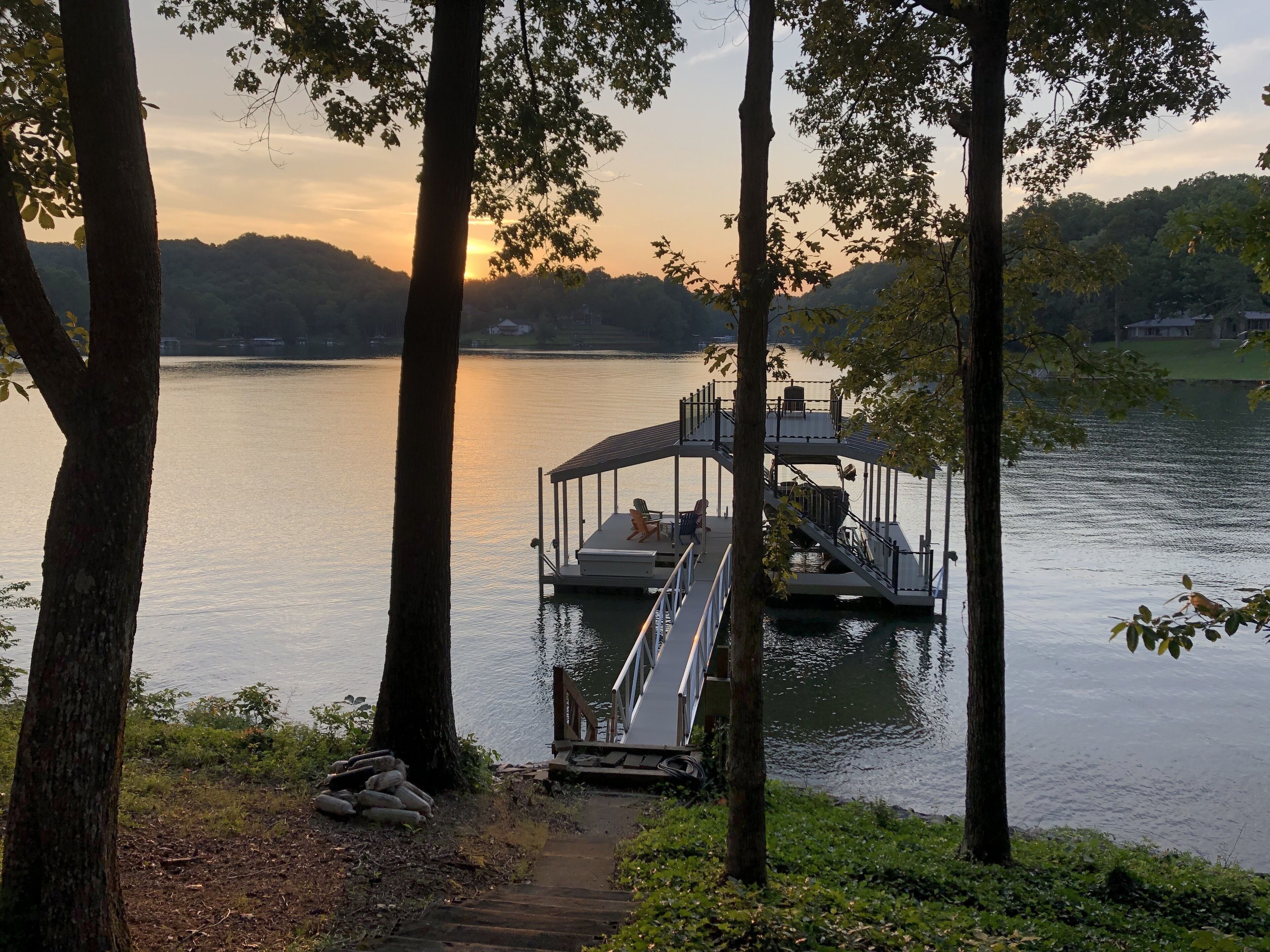 Cute cottage on Lake Lanier with dock and screened porch. 