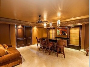 Enjoy meals together at the large dining table surrounded by comfortable chairs.