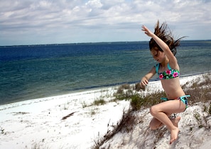 Kids love the dunes at Dog Island