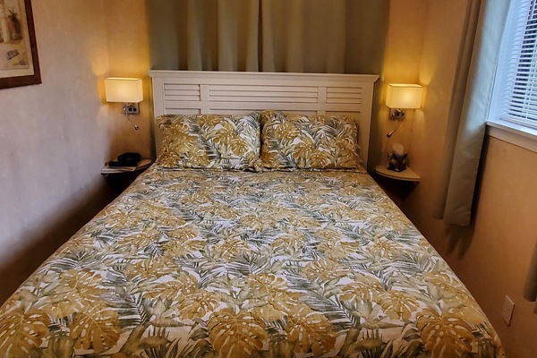 Bedroom with end unit side window and blackout curtains