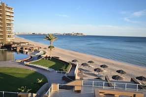 On the beach, sun-loungers, beach towels