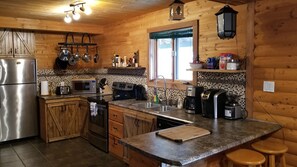 Fridge, microwave, oven, stovetop - Rustic Log Style Chalet in the Heart of Gros Morne National Park! (Woody Point, Bonne Bay)