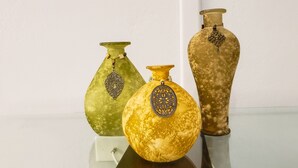 Three vases with intricate designs on a reflective surface. - Home away from home ... secure and serene location with all the comforts of home (Christiansted)