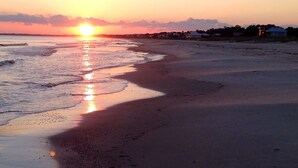 A beach at sunset with the sun reflecting on the water. -  The Beach House on Florida's Forgotten Coast (St. Joe)