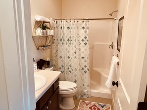 Shower, hair dryer, towels, soap
