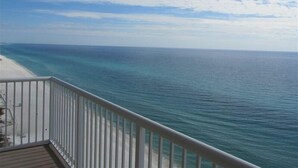 A balcony with a view of a beach and ocean. - Beautiful Majestic Beach Towers Resort #2109  (Panama City Beach)