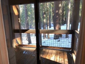 Enjoy a serene view of the forest from the comfort of your room, with a large window offering an unobstructed view of the natural surroundings.