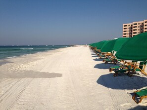 On the beach, sun loungers, beach towels