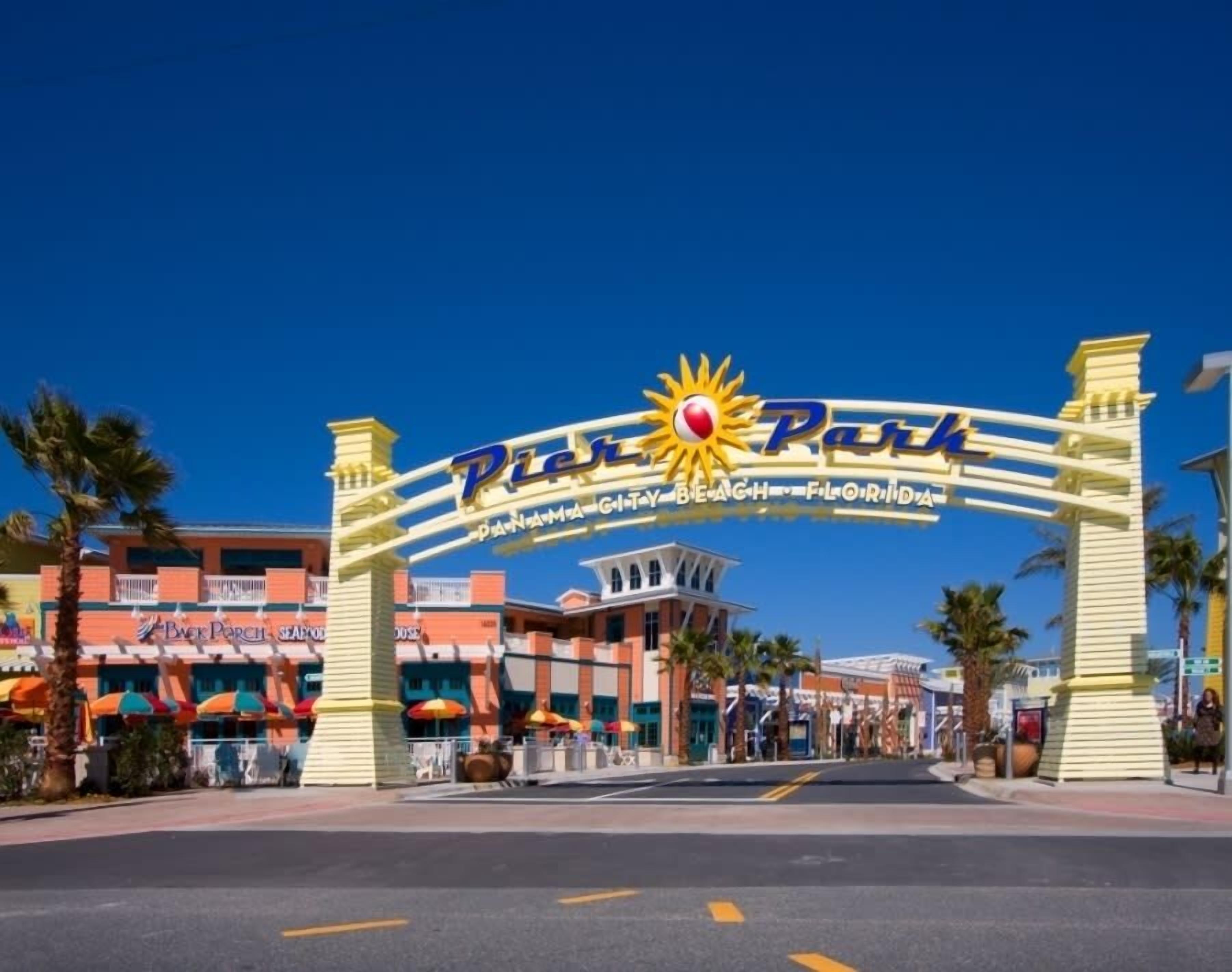 The entrance to Pier 70 with a prominent sun logo and the text 'Panama City Beach, Florida'.