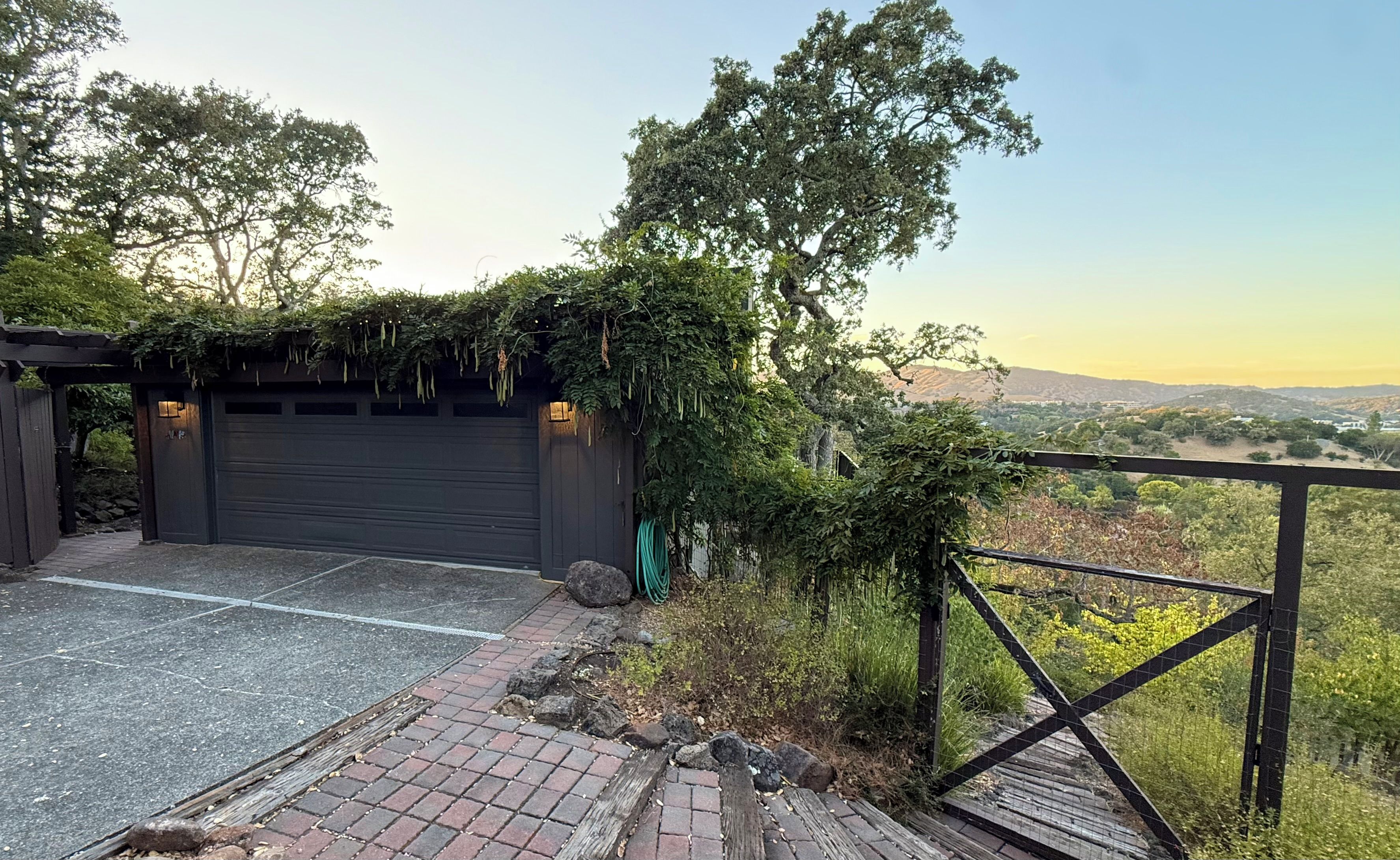 Exterior garage - with a glimpse of the amazing views you will get once inside!