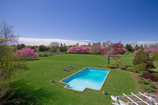 View of pool and backyard from upstairs balcony 