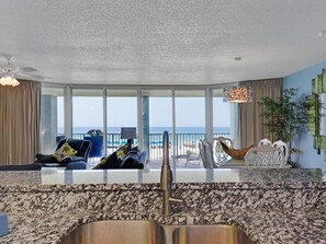 Enjoy a sea view from the spacious balcony, featuring a seating area with a sofa and chairs.