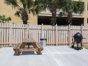 Enjoy al fresco dining on the patio, where a picnic table and barbecue grill await.