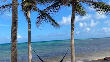 On the beach, sun-loungers, beach towels