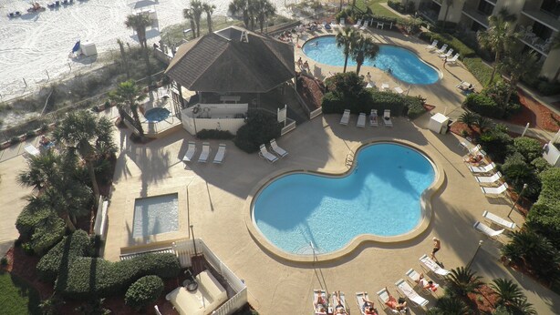 A resort with multiple swimming pools, sun loungers, and a beach area with boats. - Upgraded and Renovated! Beach Chairs Included! Book Spring Break - Great Rates! (Panama City Beach)