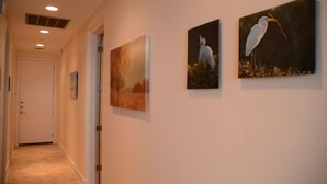 A hallway with three wall-mounted paintings of birds. - GREAT GALVESTON GETAWAY! STRESS-FREE BEACH VACATION! (Galveston)