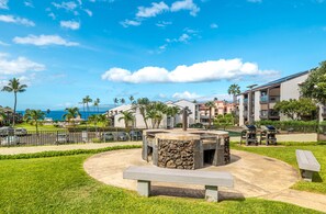 A resort with a pool, outdoor seating, and a view of the ocean. - Incredible Ocean View,  Most Desirable Unit in the Complex (Kihei)