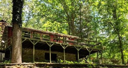 Our creekside cabin is nestled deep in the country on a secluded lane.