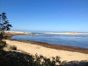 A beach with clear skies and calm waters.