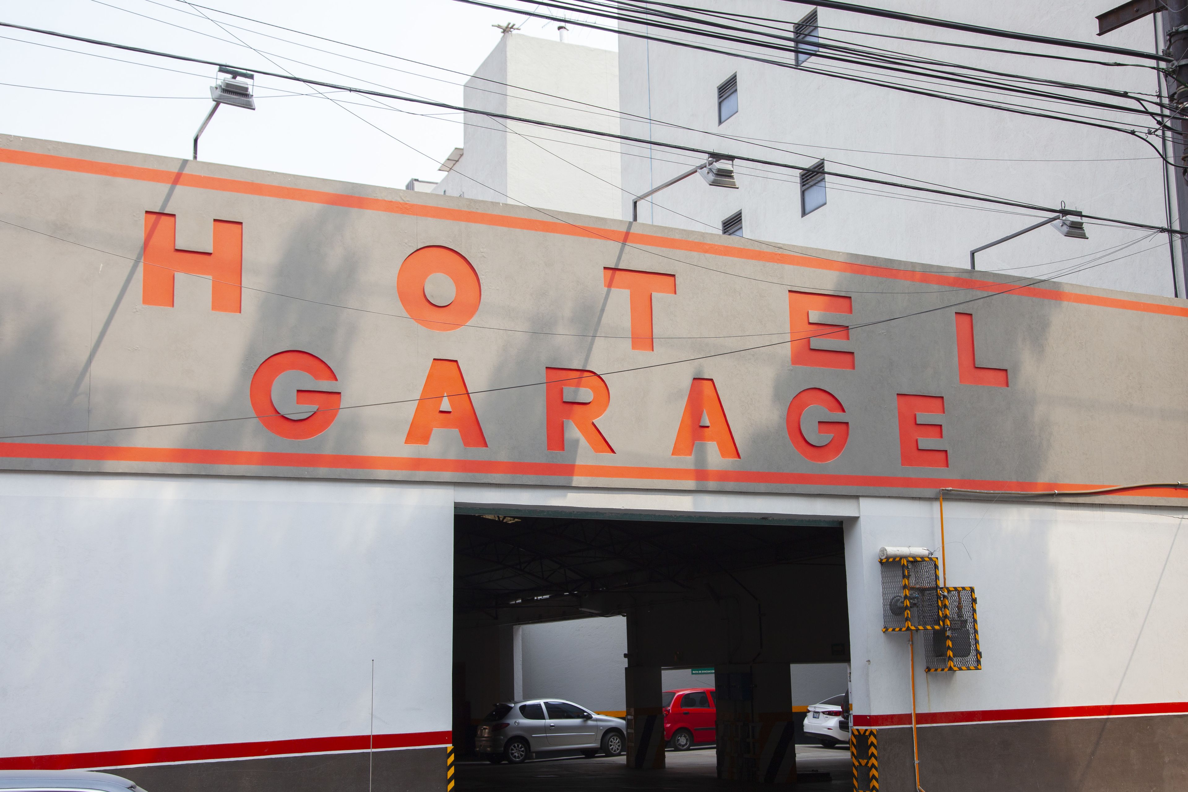A hotel garage with a large sign reading "HOTEL GARAGE".