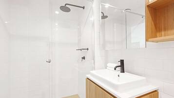 Shower, hair dryer, towels, soap