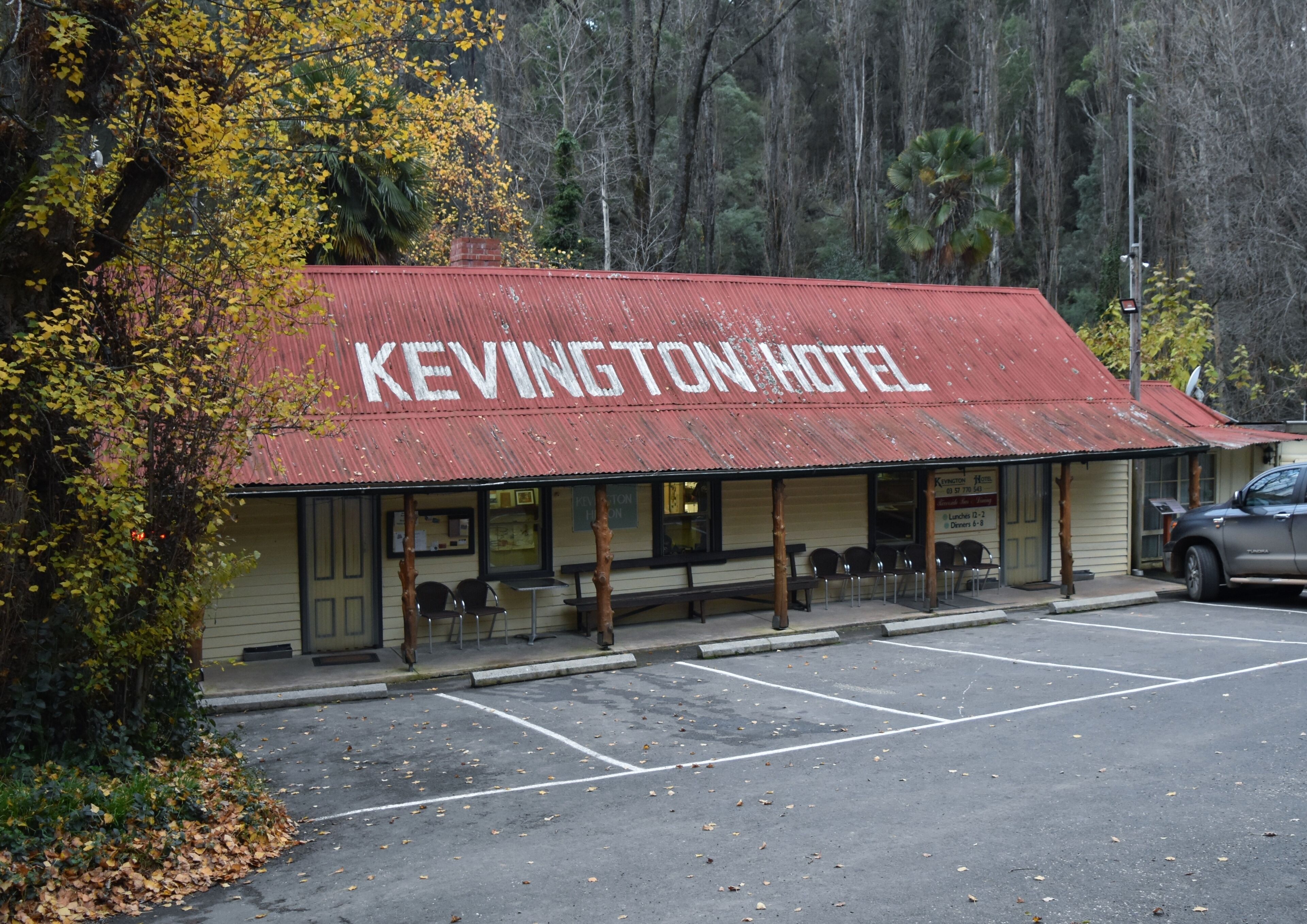 A building with a red roof labeled 'KEVINGTON HOTEL.'
