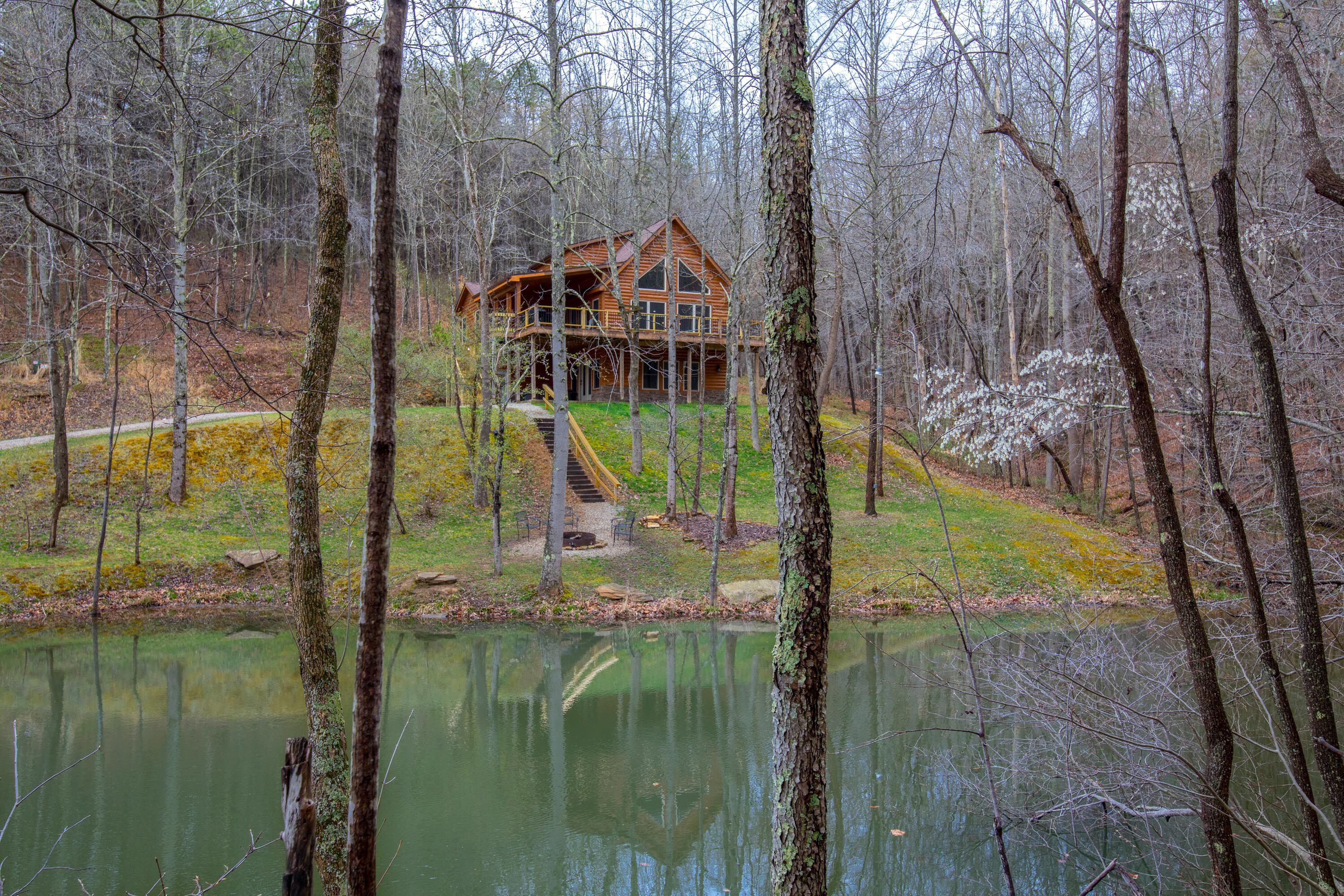Gorgeous pet friendly property with 3 BR/3 BA cabin, multipule private acres, and a pond