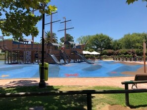 A playground with slides and climbing structures.