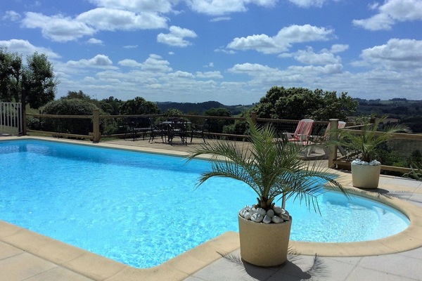 large pool with stunning views over the countryside.