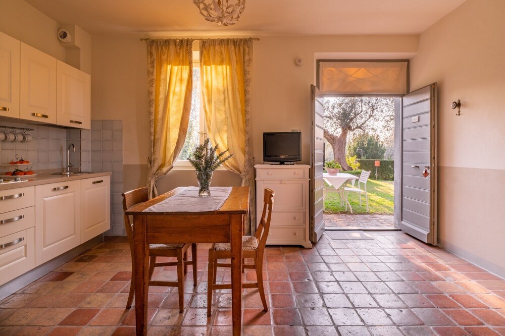 On the ground floor of an old farmhouse, in the countryside with swimming pool